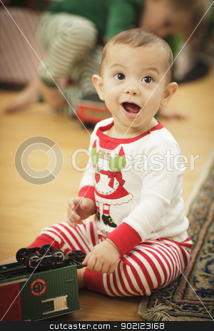 To use this stock image in your creative project, please select the size you need over to the right and click the "Add to Cart" button.
Your downloaded image will come with the Cutcaster watermark removed so don’t worry about the watermark you see on this page. Infant Baby Enjoying Christmas Morning Near The Tree stock photo, Cute Infant Baby Enjoying Christmas Morning Near The Tree. by Andy Dean