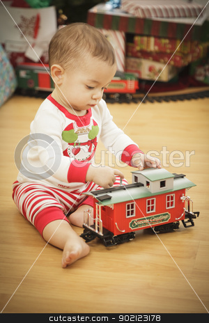 To use this stock image in your creative project, please select the size you need over to the right and click the "Add to Cart" button.
Your downloaded image will come with the Cutcaster watermark removed so don’t worry about the watermark you see on this page. Infant Baby Enjoying Christmas Morning Near The Tree stock photo, Cute Infant Baby Enjoying Christmas Morning Near The Tree. by Andy Dean