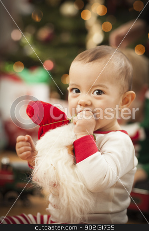 To use this stock image in your creative project, please select the size you need over to the right and click the "Add to Cart" button.
Your downloaded image will come with the Cutcaster watermark removed so don’t worry about the watermark you see on this page. Infant Mixed Race Baby Enjoying Christmas Morning Near The Tree stock photo, Cute Infant Mixed Race Baby Enjoying Christmas Morning Near The Tree. by Andy Dean