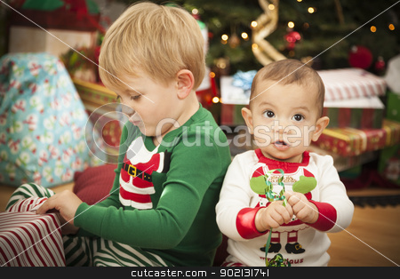 To use this stock image in your creative project, please select the size you need over to the right and click the "Add to Cart" button.
Your downloaded image will come with the Cutcaster watermark removed so don’t worry about the watermark you see on this page. Mixed Race Baby and Young Boy Enjoying Christmas Morning Near Th stock photo, Cute Infant Mixed Race Baby and Young Boy Enjoying Christmas Morning Near The Tree. by Andy Dean