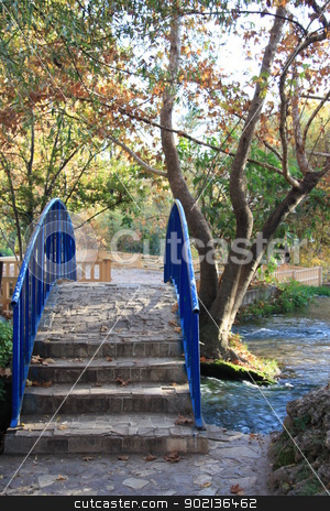 To use this stock image in your creative project, please select the size you need over to the right and click the "Add to Cart" button.
Your downloaded image will come with the Cutcaster watermark removed so don’t worry about the watermark you see on this page. Bridge over the river in Autumn park stock photo, Beautiful autumn park with a stone bridge over the river by Yulia Zhukova