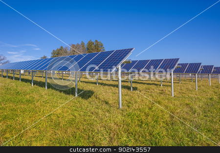 To use this stock image in your creative project, please select the size you need over to the right and click the "Add to Cart" button.
Your downloaded image will come with the Cutcaster watermark removed so don’t worry about the watermark you see on this page. Solar panels stock photo, Solar panels in field with blue sky used to furnish electricity to building by Christian Delbert