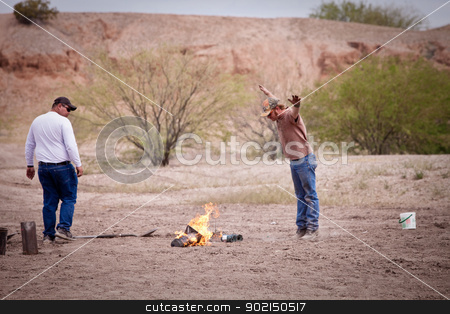To use this stock image in your creative project, please select the size you need over to the right and click the "Add to Cart" button.
Your downloaded image will come with the Cutcaster watermark removed so don’t worry about the watermark you see on this page. Movie Special Effects Worker Gesturing stock photo, Movie EFX worker gesturing over a small flame by Scott Griessel