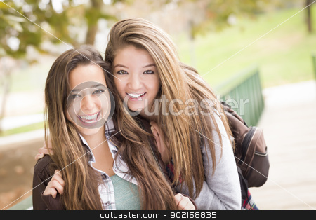 To use this stock image in your creative project, please select the size you need over to the right and click the "Add to Cart" button.
Your downloaded image will come with the Cutcaster watermark removed so don’t worry about the watermark you see on this page. Mixed Race Women Pose for a Portrait Outside stock photo, Two Attractive Mixed Race Women with Backpacks Pose for a Portrait Outside. by Andy Dean