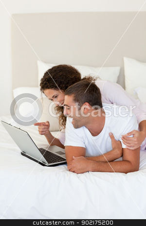 To use this stock image in your creative project, please select the size you need over to the right and click the "Add to Cart" button.
Your downloaded image will come with the Cutcaster watermark removed so don’t worry about the watermark you see on this page. Lovely couple looking at their laptop stock photo, Lovely couple looking at their laptop at home by Wavebreak Media