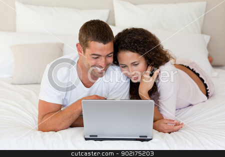 To use this stock image in your creative project, please select the size you need over to the right and click the "Add to Cart" button.
Your downloaded image will come with the Cutcaster watermark removed so don’t worry about the watermark you see on this page. Lovely couple looking at their laptop stock photo, Lovely couple looking at their laptop at home by Wavebreak Media
