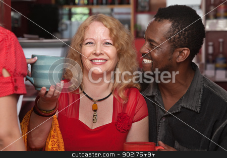 To use this stock image in your creative project, please select the size you need over to the right and click the "Add to Cart" button.
Your downloaded image will come with the Cutcaster watermark removed so don’t worry about the watermark you see on this page. Happy Mixed Couple with Mug stock photo, Cheerful African and European couple served coffee by Scott Griessel