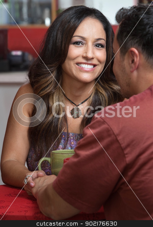 To use this stock image in your creative project, please select the size you need over to the right and click the "Add to Cart" button.
Your downloaded image will come with the Cutcaster watermark removed so don’t worry about the watermark you see on this page. Lovers Holding Hands stock photo, Smiling pretty woman holding hands with friend in bistro by Scott Griessel