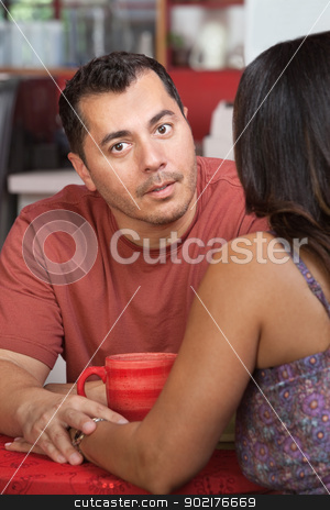 To use this stock image in your creative project, please select the size you need over to the right and click the "Add to Cart" button.
Your downloaded image will come with the Cutcaster watermark removed so don’t worry about the watermark you see on this page. Man Comforts Friend in Cafe stock photo, Hispanic man comforting female and holding her hand in cafe by Scott Griessel