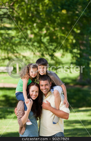 To use this stock image in your creative project, please select the size you need over to the right and click the "Add to Cart" button.
Your downloaded image will come with the Cutcaster watermark removed so don’t worry about the watermark you see on this page. Parents giving children a piggyback stock photo, Parents giving children a piggyback by Wavebreak Media