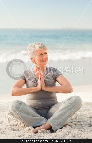 To use this stock image in your creative project, please select the size you need over to the right and click the "Add to Cart" button.
Your downloaded image will come with the Cutcaster watermark removed so don’t worry about the watermark you see on this page. Senior woman practicing yoga on the beach stock photo, Senior woman practicing yoga on the beach by Wavebreak Media