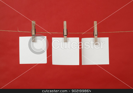 To use this stock image in your creative project, please select the size you need over to the right and click the "Add to Cart" button.
Your downloaded image will come with the Cutcaster watermark removed so don’t worry about the watermark you see on this page. Memory note papers hanging on cord stock photo, memory note paper hanging on cord on red background by Artush