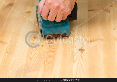 To use this stock image in your creative project, please select the size you need over to the right and click the "Add to Cart" button.
Your downloaded image will come with the Cutcaster watermark removed so don’t worry about the watermark you see on this page. Mans hand on belt sander on pine wood stock photo, Man holding a belt sander on pine floor or table sanding surface by Steven Heap
