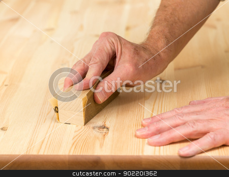 To use this stock image in your creative project, please select the size you need over to the right and click the "Add to Cart" button.
Your downloaded image will come with the Cutcaster watermark removed so don’t worry about the watermark you see on this page. Mans hand on sanding block on pine wood stock photo, Man holding sanding block on pine floor or table sanding surface by Steven Heap
