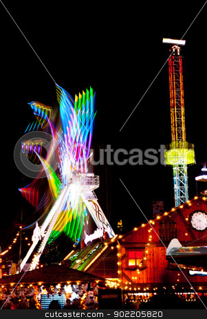 To use this stock image in your creative project, please select the size you need over to the right and click the "Add to Cart" button.
Your downloaded image will come with the Cutcaster watermark removed so don’t worry about the watermark you see on this page. Amusement park stock photo, long exposure pictures of amusement park rides and wheels at night by Desislava Dimitrova