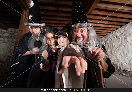 To use this stock image in your creative project, please select the size you need over to the right and click the "Add to Cart" button.
Your downloaded image will come with the Cutcaster watermark removed so don’t worry about the watermark you see on this page. Mythical Family of Wizards stock photo, Father and children in mythical wizard costumes by Scott Griessel