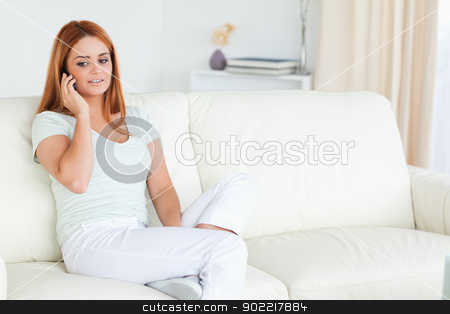 To use this stock image in your creative project, please select the size you need over to the right and click the "Add to Cart" button.
Your downloaded image will come with the Cutcaster watermark removed so don’t worry about the watermark you see on this page. Woman sitting on a sofa with a phone stock photo, Woman sitting on a sofa with a phone in a living room by Wavebreak Media