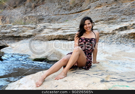 To use this stock image in your creative project, please select the size you need over to the right and click the "Add to Cart" button.
Your downloaded image will come with the Cutcaster watermark removed so don’t worry about the watermark you see on this page. Young Hispanic Woman stock photo, Young Hispanic woman near a creek. by Henrik Lehnerer