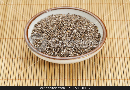 To use this stock image in your creative project, please select the size you need over to the right and click the "Add to Cart" button.
Your downloaded image will come with the Cutcaster watermark removed so don’t worry about the watermark you see on this page. bowl of chia seeds stock photo, chia seeds in a ceramic bowl against bamboo mat by Marek Uliasz