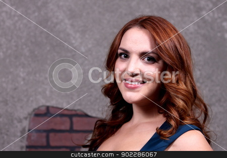 To use this stock image in your creative project, please select the size you need over to the right and click the "Add to Cart" button.
Your downloaded image will come with the Cutcaster watermark removed so don’t worry about the watermark you see on this page. Woman Red Hair stock photo, Red hair woman with blue dress in front of dark background. by Henrik Lehnerer