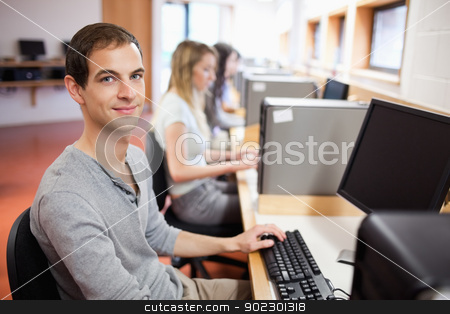 To use this stock image in your creative project, please select the size you need over to the right and click the "Add to Cart" button.
Your downloaded image will come with the Cutcaster watermark removed so don’t worry about the watermark you see on this page. Smiling male student posing with a computer stock photo, Smiling male student posing with a computer in an IT room by Wavebreak Media