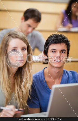 To use this stock image in your creative project, please select the size you need over to the right and click the "Add to Cart" button.
Your downloaded image will come with the Cutcaster watermark removed so don’t worry about the watermark you see on this page. Portrait of young students posing with a laptop stock photo, Portrait of young students posing with a laptop in an amphitheater by Wavebreak Media