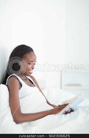 To use this stock image in your creative project, please select the size you need over to the right and click the "Add to Cart" button.
Your downloaded image will come with the Cutcaster watermark removed so don’t worry about the watermark you see on this page. Portrait of a woman reading a book stock photo, Portrait of a woman reading a book in her bedroom by Wavebreak Media