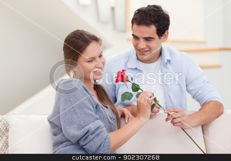 To use this stock image in your creative project, please select the size you need over to the right and click the "Add to Cart" button.
Your downloaded image will come with the Cutcaster watermark removed so don’t worry about the watermark you see on this page. Man offering a rose to his fiance stock photo, Man offering a rose to his fiance in their living room by Wavebreak Media