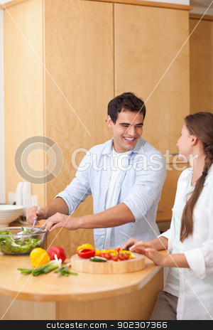 To use this stock image in your creative project, please select the size you need over to the right and click the "Add to Cart" button.
Your downloaded image will come with the Cutcaster watermark removed so don’t worry about the watermark you see on this page. Portrait of a couple preparing a salad stock photo, Portrait of a couple preparing a salad in their kitchen by Wavebreak Media