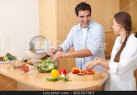 To use this stock image in your creative project, please select the size you need over to the right and click the "Add to Cart" button.
Your downloaded image will come with the Cutcaster watermark removed so don’t worry about the watermark you see on this page. Smiling couple preparing a salad stock photo, Smiling couple preparing a salad in their kitchen by Wavebreak Media