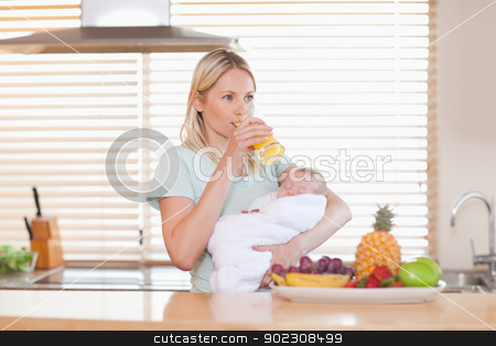 To use this stock image in your creative project, please select the size you need over to the right and click the "Add to Cart" button.
Your downloaded image will come with the Cutcaster watermark removed so don’t worry about the watermark you see on this page. Woman taking a sip of juice while holding her baby stock photo, Woman taking a sip of orange juice while holding her baby by Wavebreak Media