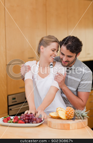 To use this stock image in your creative project, please select the size you need over to the right and click the "Add to Cart" button.
Your downloaded image will come with the Cutcaster watermark removed so don’t worry about the watermark you see on this page. Portrait of a lovely couple eating fruits stock photo, Portrait of a lovely couple eating fruits in their kitchen by Wavebreak Media