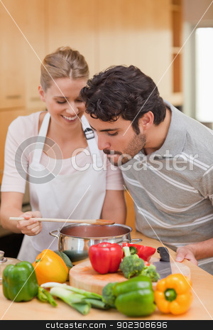To use this stock image in your creative project, please select the size you need over to the right and click the "Add to Cart" button.
Your downloaded image will come with the Cutcaster watermark removed so don’t worry about the watermark you see on this page. Portrait of a happy couple preparing a sauce stock photo, Portrait of a happy couple preparing a sauce in their kitchen by Wavebreak Media