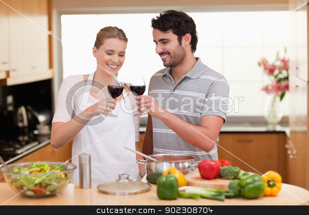 To use this stock image in your creative project, please select the size you need over to the right and click the "Add to Cart" button.
Your downloaded image will come with the Cutcaster watermark removed so don’t worry about the watermark you see on this page. Couple drinking a glass of wine stock photo, Couple drinking a glass of wine in their kitchen by Wavebreak Media