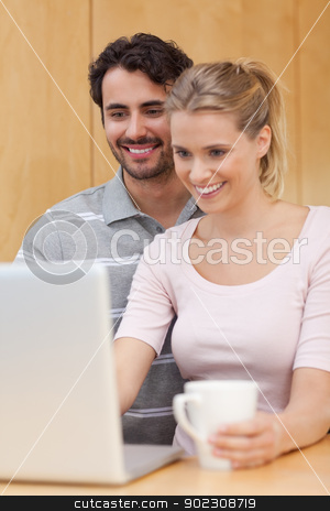 To use this stock image in your creative project, please select the size you need over to the right and click the "Add to Cart" button.
Your downloaded image will come with the Cutcaster watermark removed so don’t worry about the watermark you see on this page. Portrait of a couple using a notebook while having coffee stock photo, Portrait of a couple using a notebook while having coffee in their kitchen by Wavebreak Media