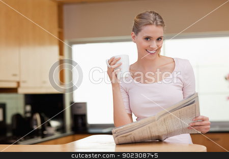 To use this stock image in your creative project, please select the size you need over to the right and click the "Add to Cart" button.
Your downloaded image will come with the Cutcaster watermark removed so don’t worry about the watermark you see on this page. Young woman reading the news while having coffee stock photo, Young woman reading the news while having coffee in her kitchen by Wavebreak Media