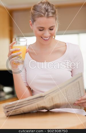 To use this stock image in your creative project, please select the size you need over to the right and click the "Add to Cart" button.
Your downloaded image will come with the Cutcaster watermark removed so don’t worry about the watermark you see on this page. Portrait of a woman reading the news while drinking orange juice stock photo, Portrait of a woman reading the news while drinking orange juice in her kitchen by Wavebreak Media