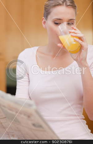 To use this stock image in your creative project, please select the size you need over to the right and click the "Add to Cart" button.
Your downloaded image will come with the Cutcaster watermark removed so don’t worry about the watermark you see on this page. Portrait of a beautiful woman reading the news while drinking ju stock photo, Portrait of a beautiful woman reading the news while drinking juice in her kitchen by Wavebreak Media