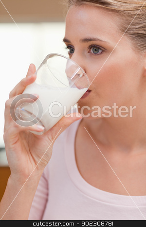 To use this stock image in your creative project, please select the size you need over to the right and click the "Add to Cart" button.
Your downloaded image will come with the Cutcaster watermark removed so don’t worry about the watermark you see on this page. Portrait of a woman drinking a glass of milk stock photo, Portrait of a woman drinking a glass of milk in her kitchen by Wavebreak Media