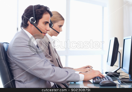 To use this stock image in your creative project, please select the size you need over to the right and click the "Add to Cart" button.
Your downloaded image will come with the Cutcaster watermark removed so don’t worry about the watermark you see on this page. Operators using a computer stock photo, Operators using a computer in a call center by Wavebreak Media