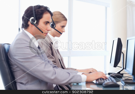 To use this stock image in your creative project, please select the size you need over to the right and click the "Add to Cart" button.
Your downloaded image will come with the Cutcaster watermark removed so don’t worry about the watermark you see on this page. Young operators using a computer stock photo, Young operators using a computer in a call center by Wavebreak Media