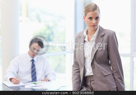 To use this stock image in your creative project, please select the size you need over to the right and click the "Add to Cart" button.
Your downloaded image will come with the Cutcaster watermark removed so don’t worry about the watermark you see on this page. Businesswoman posing while her colleague is working stock photo, Businesswoman posing while her colleague is working in a meeting room by Wavebreak Media