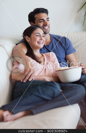 To use this stock image in your creative project, please select the size you need over to the right and click the "Add to Cart" button.
Your downloaded image will come with the Cutcaster watermark removed so don’t worry about the watermark you see on this page. Portrait of a happy couple watching television while eating popc stock photo, Portrait of a happy couple watching television while eating popcorn in their living room by Wavebreak Media