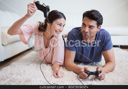 To use this stock image in your creative project, please select the size you need over to the right and click the "Add to Cart" button.
Your downloaded image will come with the Cutcaster watermark removed so don’t worry about the watermark you see on this page. Woman beating her fiance while playing video games stock photo, Woman beating her fiance while playing video games in their living room by Wavebreak Media