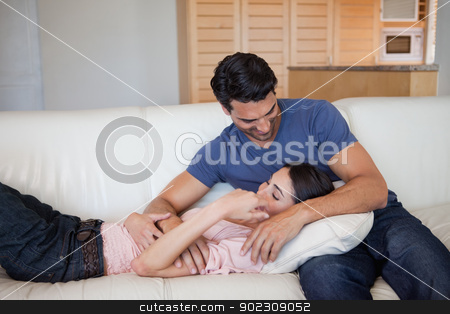 To use this stock image in your creative project, please select the size you need over to the right and click the "Add to Cart" button.
Your downloaded image will come with the Cutcaster watermark removed so don’t worry about the watermark you see on this page. Lovely couple cuddling each other stock photo, Lovely couple cuddling each other in their living room by Wavebreak Media