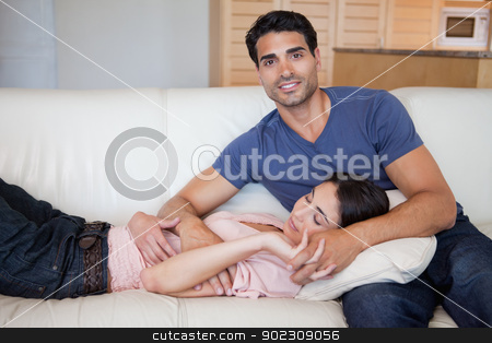 To use this stock image in your creative project, please select the size you need over to the right and click the "Add to Cart" button.
Your downloaded image will come with the Cutcaster watermark removed so don’t worry about the watermark you see on this page. Woman sleeping while his boyfriend is posing stock photo, Woman sleeping while his boyfriend is posing in their living room by Wavebreak Media