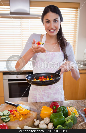 To use this stock image in your creative project, please select the size you need over to the right and click the "Add to Cart" button.
Your downloaded image will come with the Cutcaster watermark removed so don’t worry about the watermark you see on this page. Portrait of a young woman preparing a dish stock photo, Portrait of a young woman preparing a dish in her kitchen by Wavebreak Media