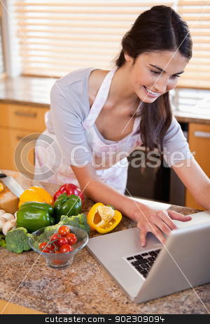 To use this stock image in your creative project, please select the size you need over to the right and click the "Add to Cart" button.
Your downloaded image will come with the Cutcaster watermark removed so don’t worry about the watermark you see on this page. Portrait of a woman looking for a recipe on the internet stock photo, Portrait of a woman looking for a recipe on the internet in her kitchen by Wavebreak Media