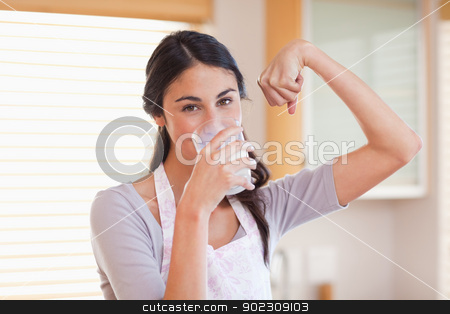 To use this stock image in your creative project, please select the size you need over to the right and click the "Add to Cart" button.
Your downloaded image will come with the Cutcaster watermark removed so don’t worry about the watermark you see on this page. Healthy woman drinking milk stock photo, Healthy woman drinking milk in her kitchen by Wavebreak Media