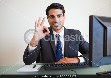To use this stock image in your creative project, please select the size you need over to the right and click the "Add to Cart" button.
Your downloaded image will come with the Cutcaster watermark removed so don’t worry about the watermark you see on this page. Businessman showing everything is perfect stock photo, Businessman showing everything is perfect in his office by Wavebreak Media